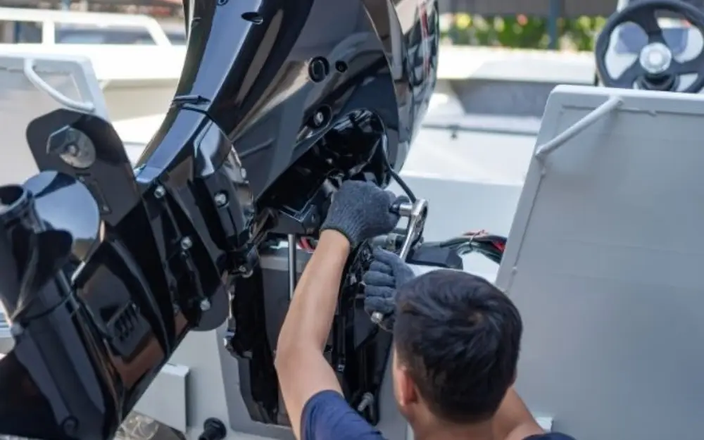 Outboard motor being serviced