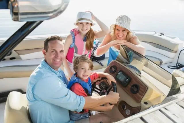 Family enjoying a day out on their boat